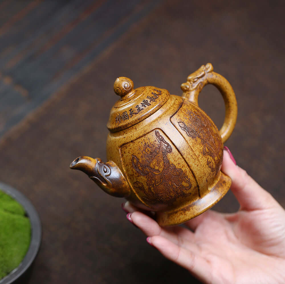 Handmade Yixing purple sand teapot with intricate designs, perfect for kung fu tea sets and collectors.