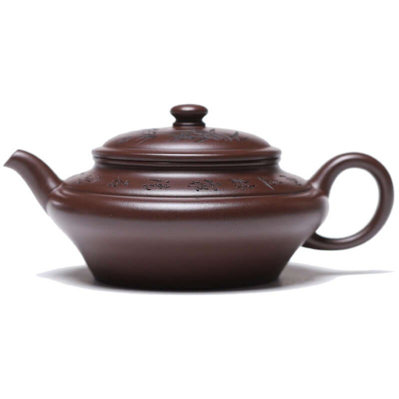 Handmade Yixing purple sand teapot with intricate designs and a large capacity of 570ml, perfect for tea lovers.