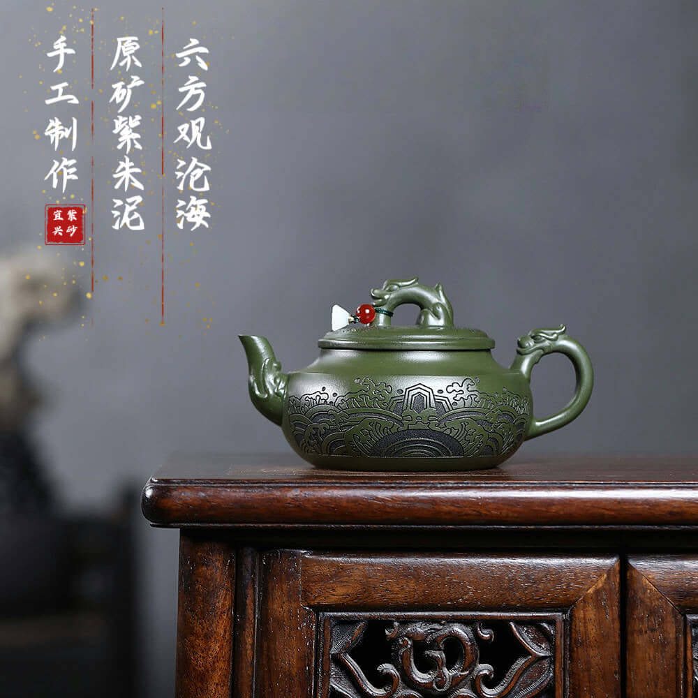 Handmade Yixing purple sand teapot in green clay, featuring intricate designs, perfect for kung fu tea sets.