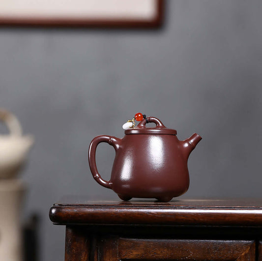 Handmade Yixing purple sand teapot showcasing original mineral clay with decorative lid, perfect for Kung Fu tea sets.