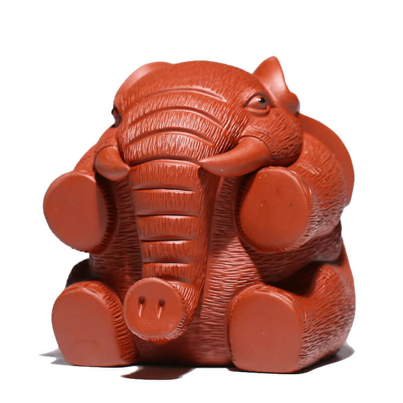 Handmade Yixing purple sand elephant sculpture, a creative tea table decoration symbolizing good fortune.