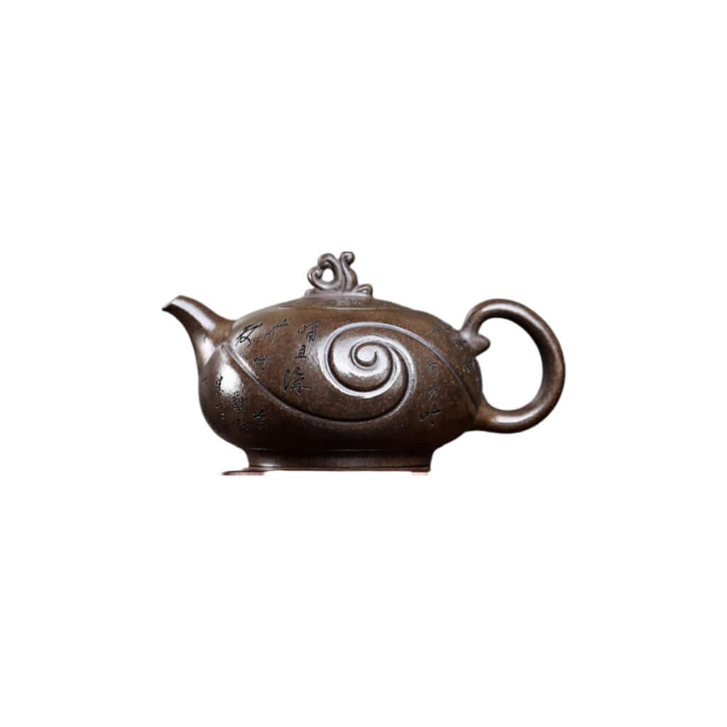 Handmade Yixing purple sand teapot, featuring ancient copper mud and intricate design for authentic kung fu tea experience.