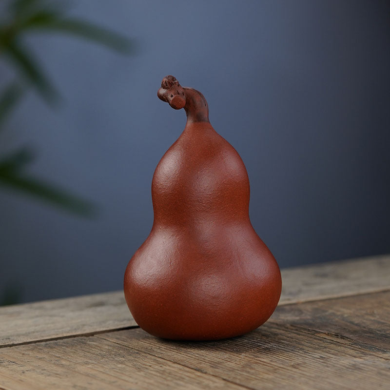 Handmade Yixing purple sand gourd tea pet sculpture, perfect for tea lovers and collectors, showcasing original craftsmanship.