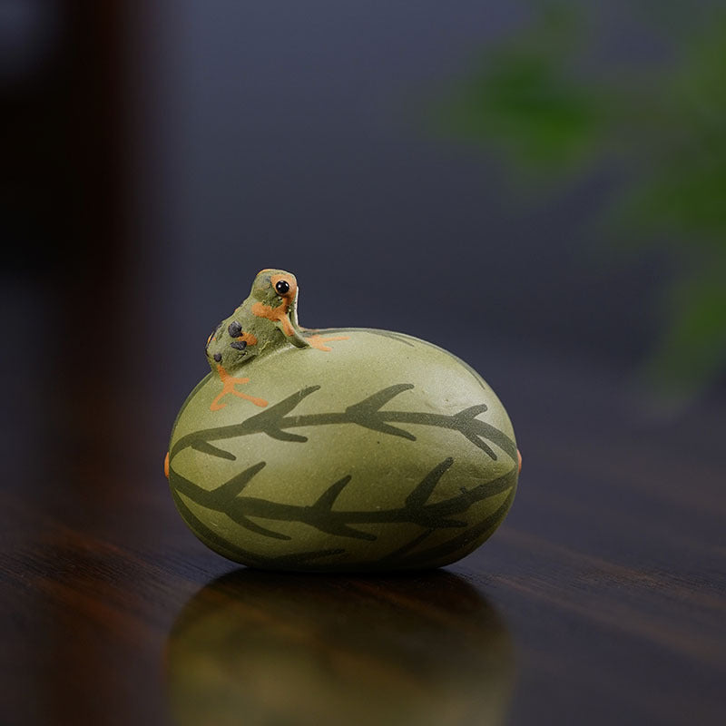 Handmade Yixing purple sand tea pet sculpture featuring a frog on a gourd, showcasing original craftsmanship.