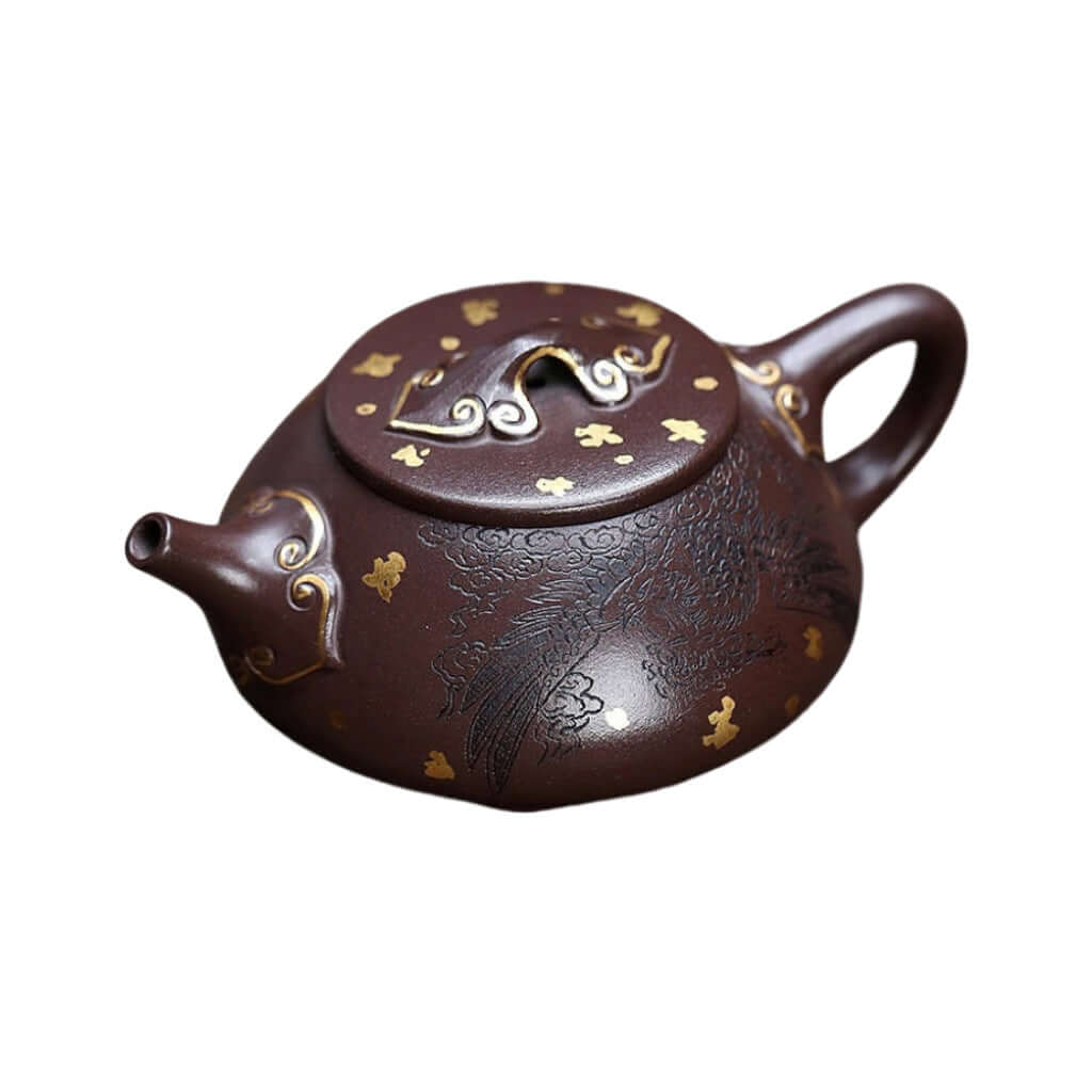 Handmade Yixing purple sand teapot with gold phoenix design, original clay, traditional craftsmanship, ideal for household tea set.