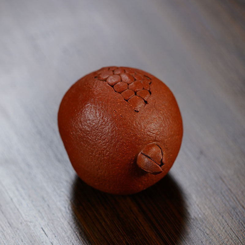 Handmade Yixing purple sand tea pet sculpture with intricate details, perfect for tea lovers and collectors.