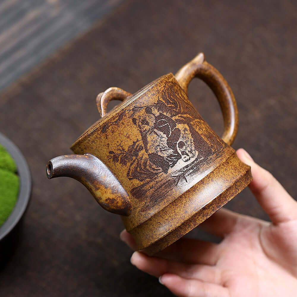 Handmade Yixing purple sand teapot featuring panda and bamboo design, crafted from raw ore high-temperature clay.