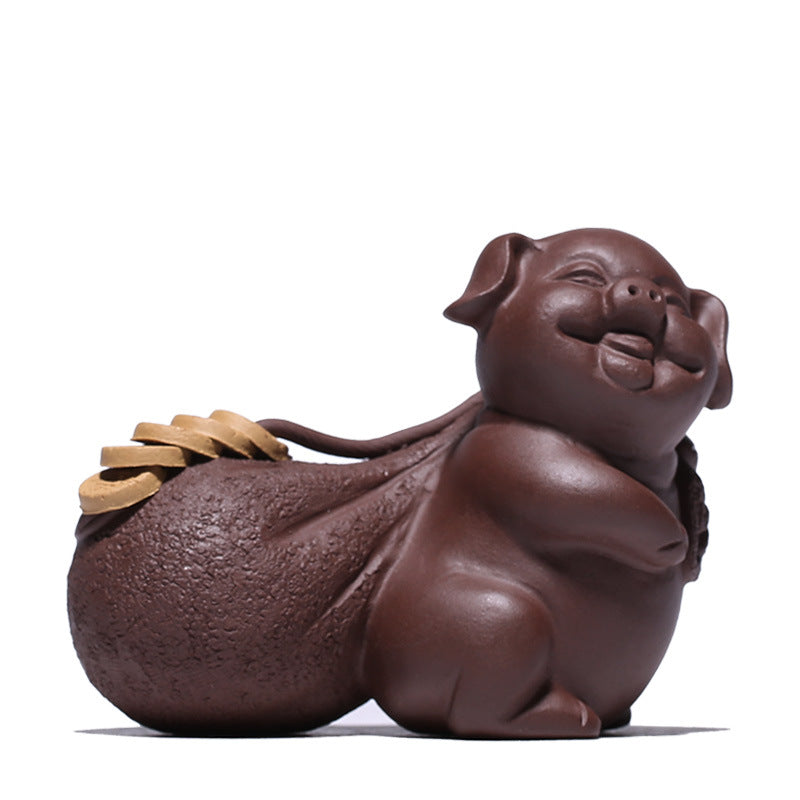 Handmade Yixing purple sand pig decoration symbolizing wealth and fortune, perfect for tea tray decor.