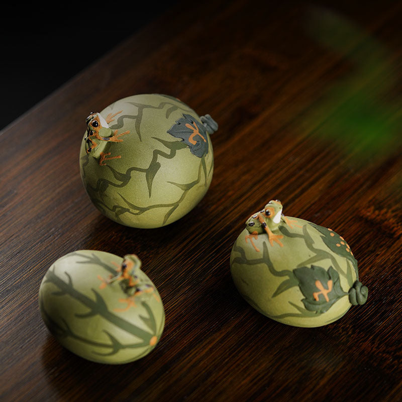 Handmade Yixing purple sand tea pet ornaments in frog design, perfect for enhancing your tea set and experience.