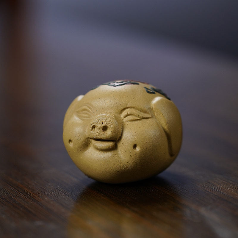 Handmade Yixing purple sand pig sculpture, a unique tea pet ornament for tea enthusiasts.