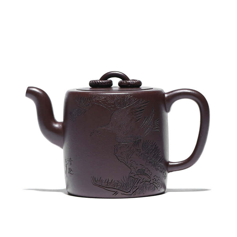 Handmade Yixing purple sand teapot with intricate bird design, showcasing traditional craftsmanship and elegant form.