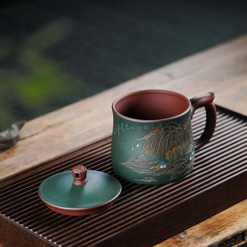 Handmade Yixing purple sand tea cup featuring lake and mountain scenery, perfect for office use, large capacity.