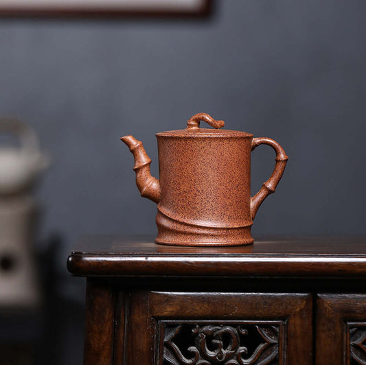 Handmade Yixing purple sand teapot with bamboo design, perfect for Kung Fu tea sets, showcasing unique craftsmanship.