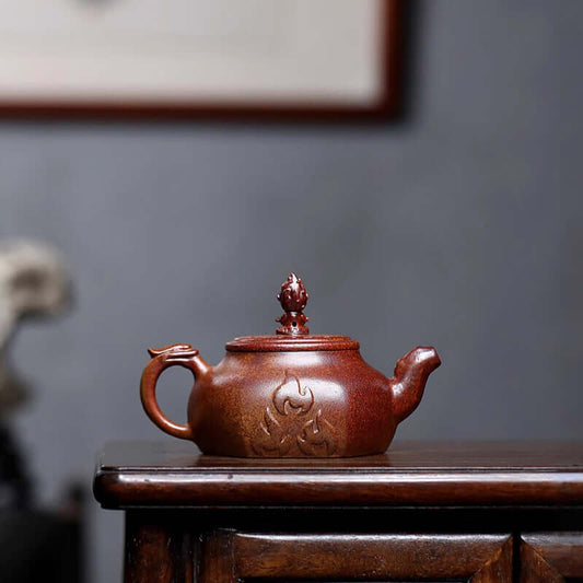 Handmade Yixing purple sand teapot with intricate design, crafted from original purple clay, perfect for home tea sets.