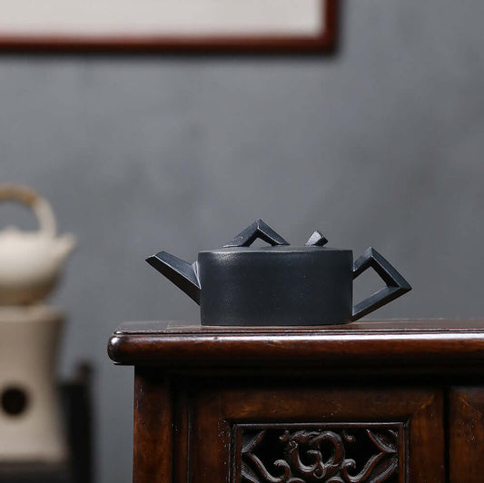Handmade Yixing purple sand teapot, geometric design, crafted from raw ore, perfect for kung fu tea sets.