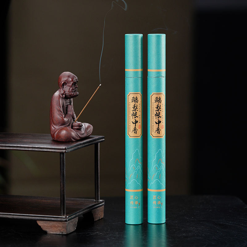 Handmade Yixing purple sand tea pet sculpture with incense sticks, showcasing unique tea accessories and craftsmanship.