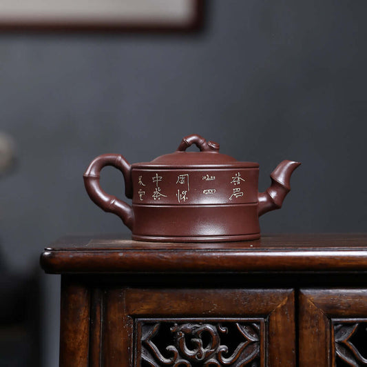 Handmade Yixing purple sand teapot with engraved landscape, ideal for kung fu tea set, raw ore purple clay craftsmanship.