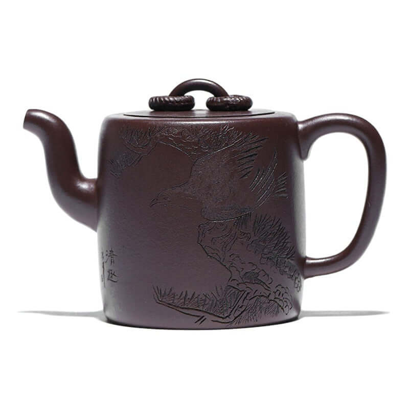 Handmade Yixing purple sand teapot with intricate bird design, showcasing traditional craftsmanship in rich purple clay.