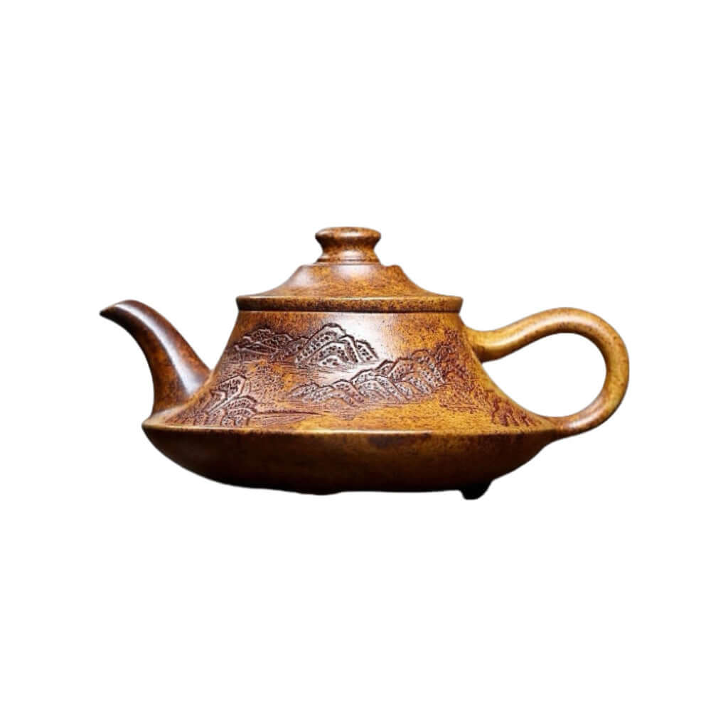 Handmade Yixing purple sand teapot featuring intricate mountain designs, perfect for home kung fu tea ceremonies.