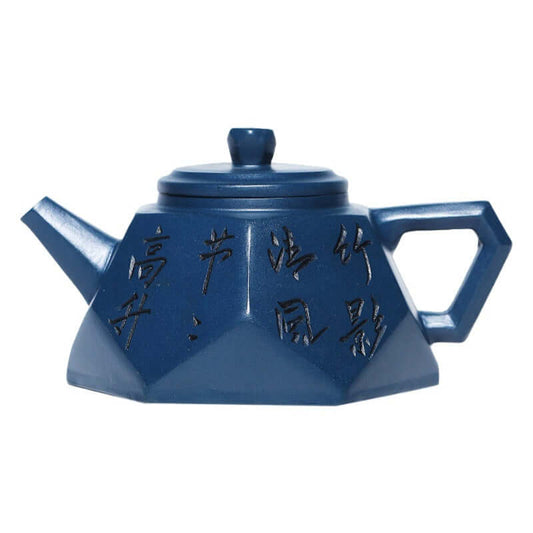 Handmade Yixing purple sand teapot featuring a diamond shape and engraved calligraphy, perfect for tea brewing.