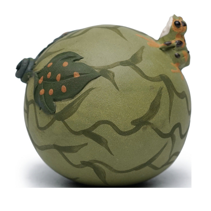 Handmade Yixing purple sand frog ornament styled as a watermelon, featuring intricate green details.