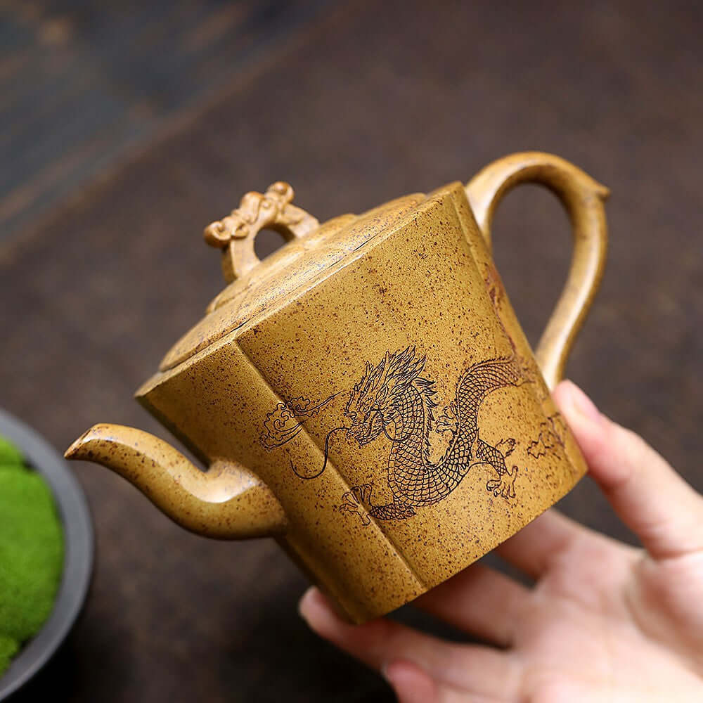 Handmade Yixing purple sand teapot featuring a dragon design, perfect for kung fu tea ceremonies.