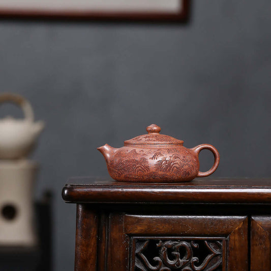 Handmade Yixing purple sand teapot with intricate design, perfect for Kung Fu tea set and dropshipping.