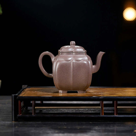 Handmade Yixing purple sand teapot with unique texture, showcasing craftsmanship and original design.