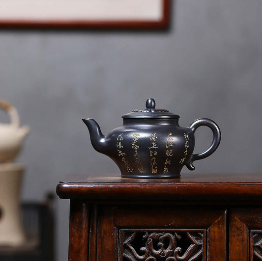 Handmade Yixing purple sand teapot with gold-painted design, perfect for Kung Fu tea set and home use.