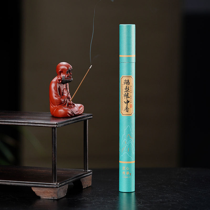 Handmade Yixing purple sand tea pet sculpture with incense stick, showcasing traditional craftsmanship and tea accessories.