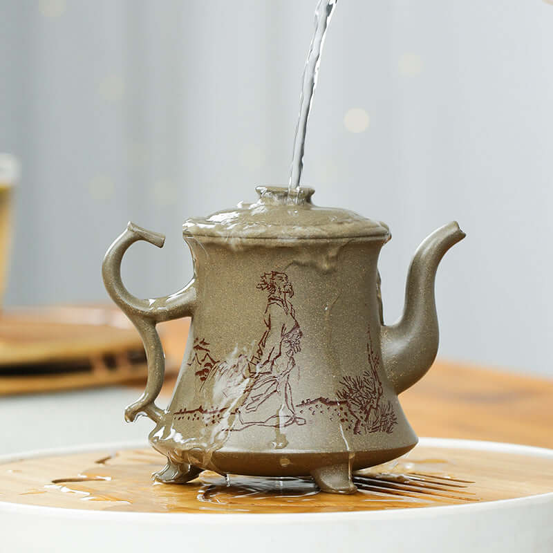 Handmade Yixing purple sand teapot with intricate artwork, pouring water elegantly from its spout.
