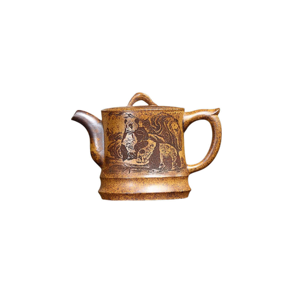 Handmade Yixing purple sand teapot featuring panda and bamboo design for traditional tea serving.