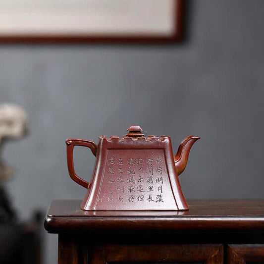Handmade Yixing purple sand teapot with ancient inscriptions, crafted from original purple clay, perfect for tea lovers.