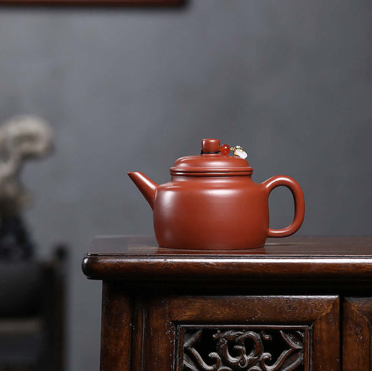 Handmade Yixing purple sand teapot, original Zhu Ni Jian Liude style on wooden table, perfect for Kung Fu tea set.
