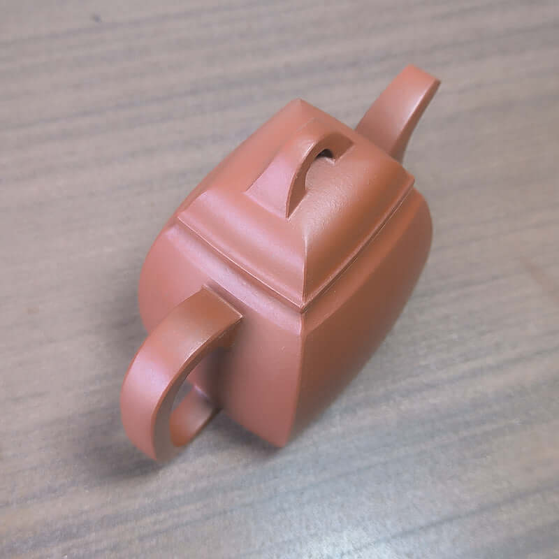 Handmade Yixing purple sand teapot with a traditional design, crafted from original purple clay for tea enthusiasts.