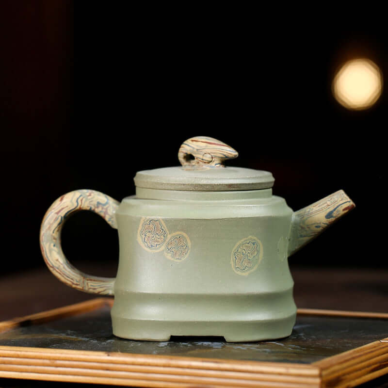 Handmade Yixing purple sand teapot with unique twisted handle and intricate design, ideal for kung fu tea.