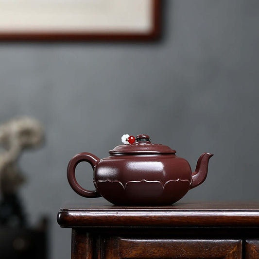 Handmade Yixing purple sand teapot with elegant design, perfect for kung fu tea sets and tea ceremonies.