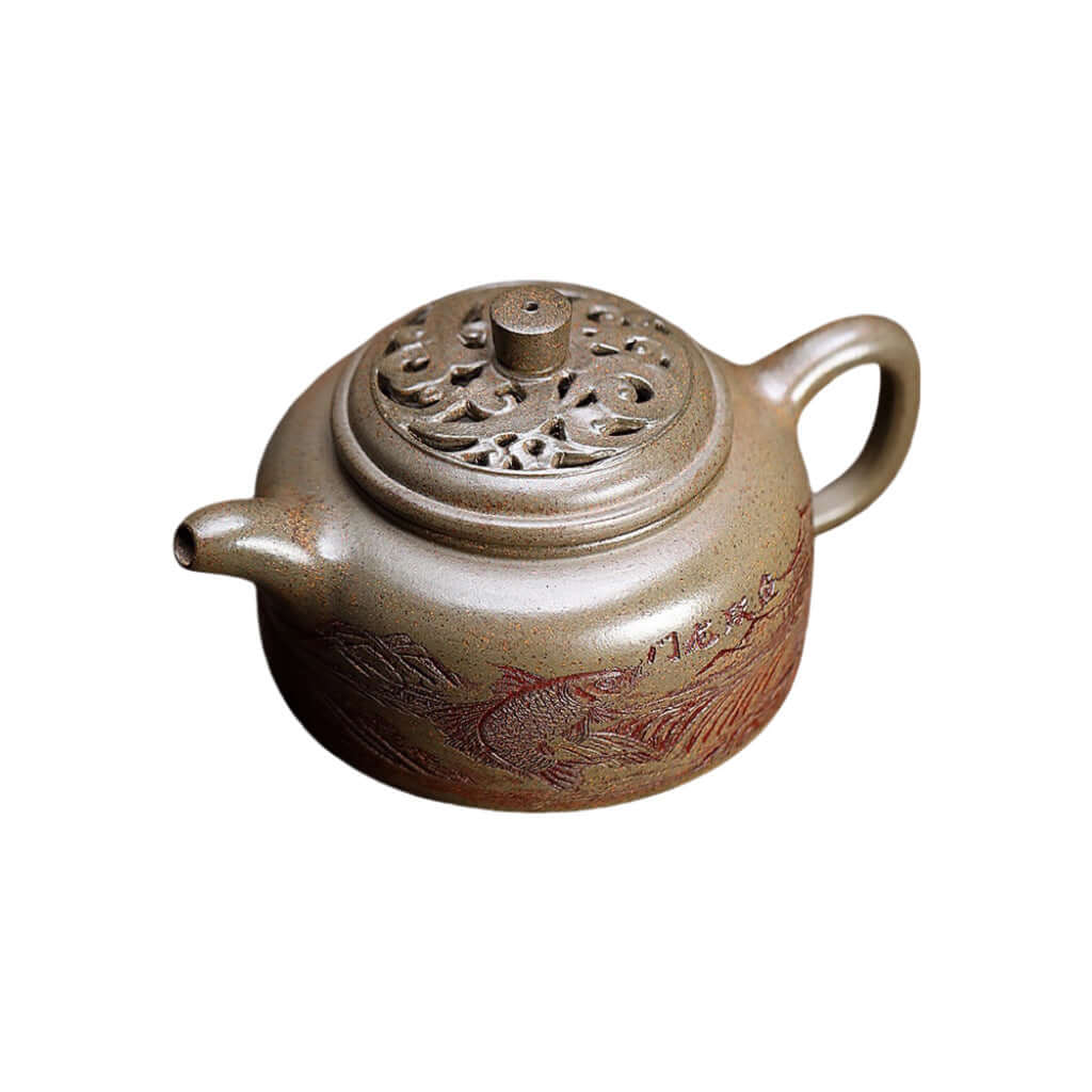 Handmade Yixing purple sand teapot with intricate dragon design, crafted by Yixing artisans for a unique tea experience.