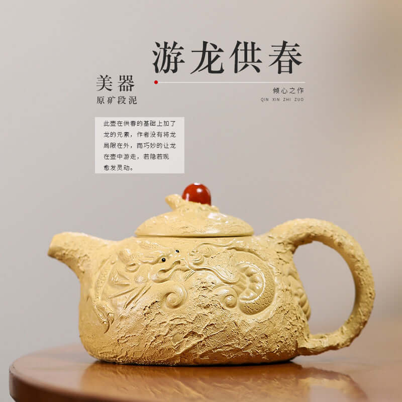 Handmade Yixing purple sand teapot with intricate design and red lid, showcasing traditional craftsmanship.