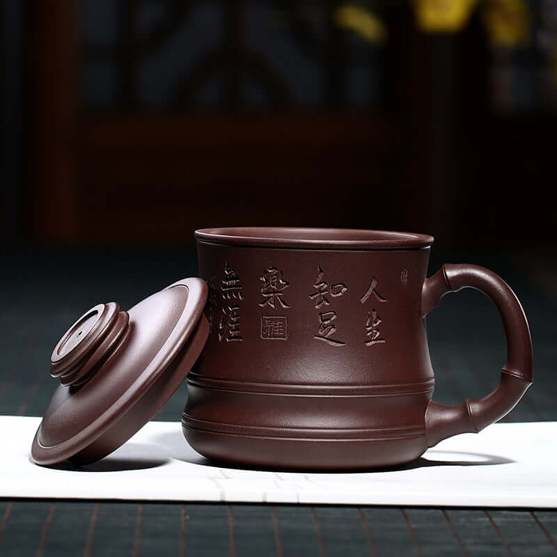 Handmade Yixing purple sand teapot with lid, featuring embossed characters and crafted from original purple sand.