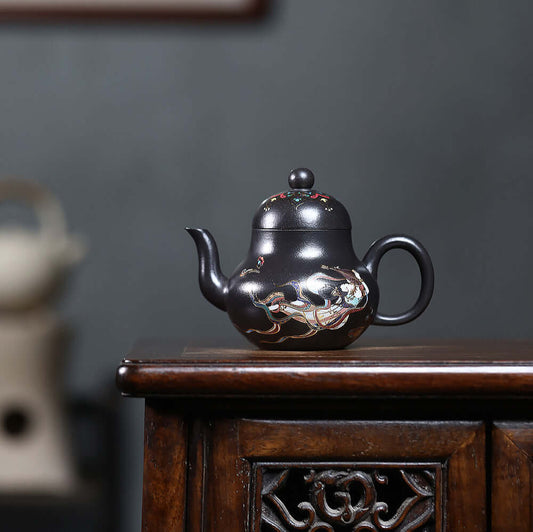 Handmade Yixing purple sand teapot in black iron stone with yellow enamel, perfect for kung fu tea sets.