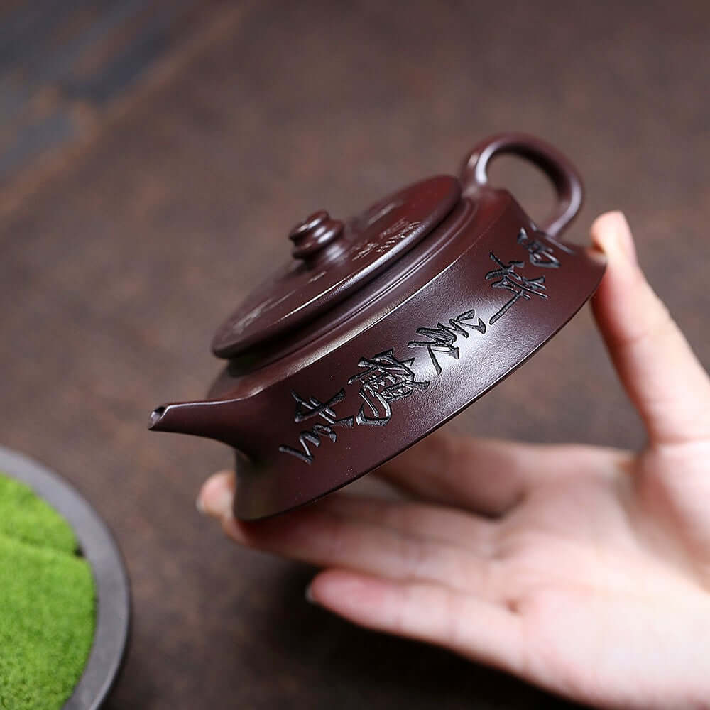 Handmade Yixing purple sand teapot showing intricate design, perfect for home kung fu tea set.