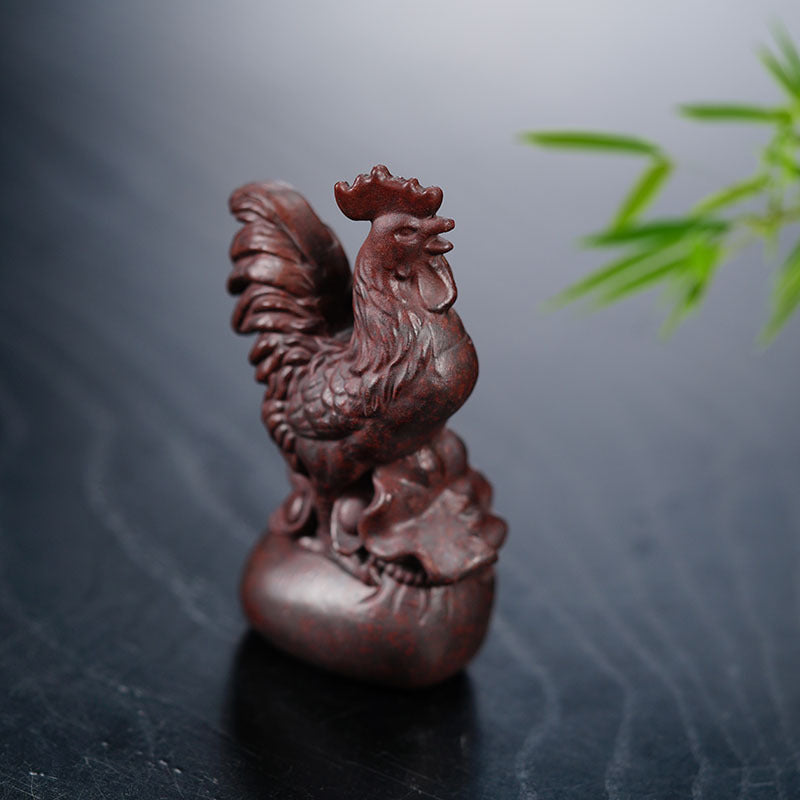 Handmade Yixing purple sand rooster tea pet ornament for tea enthusiasts, symbolizing good luck and handcrafted artistry.