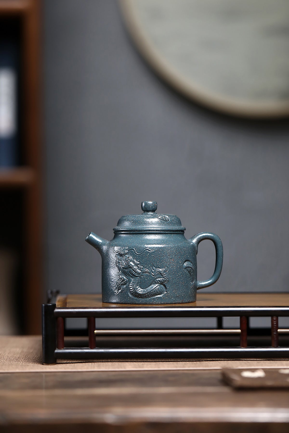 Handmade Yixing purple sand teapot, featuring intricate dragon relief design and traditional craftsmanship.