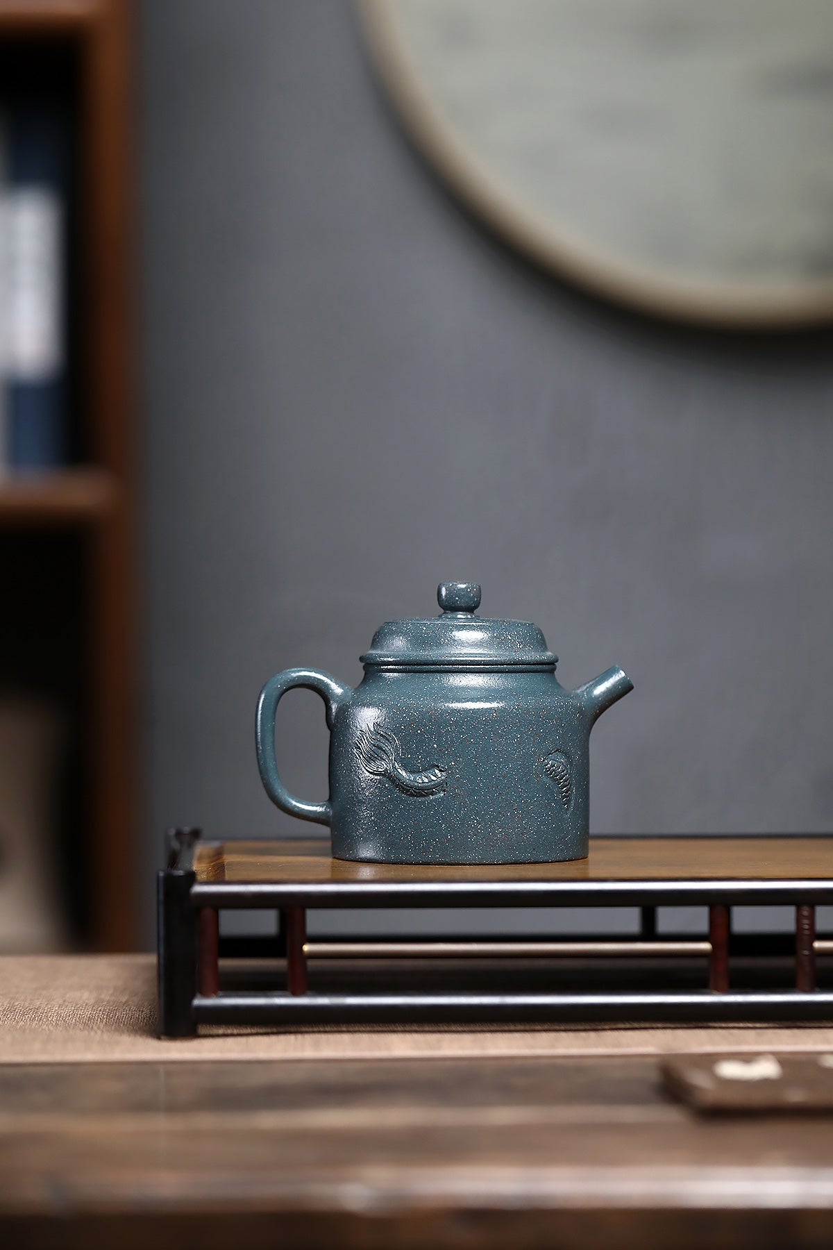 Handmade Yixing purple sand teapot by master Chen Xuehe, featuring intricate dragon design and elegant craftsmanship.