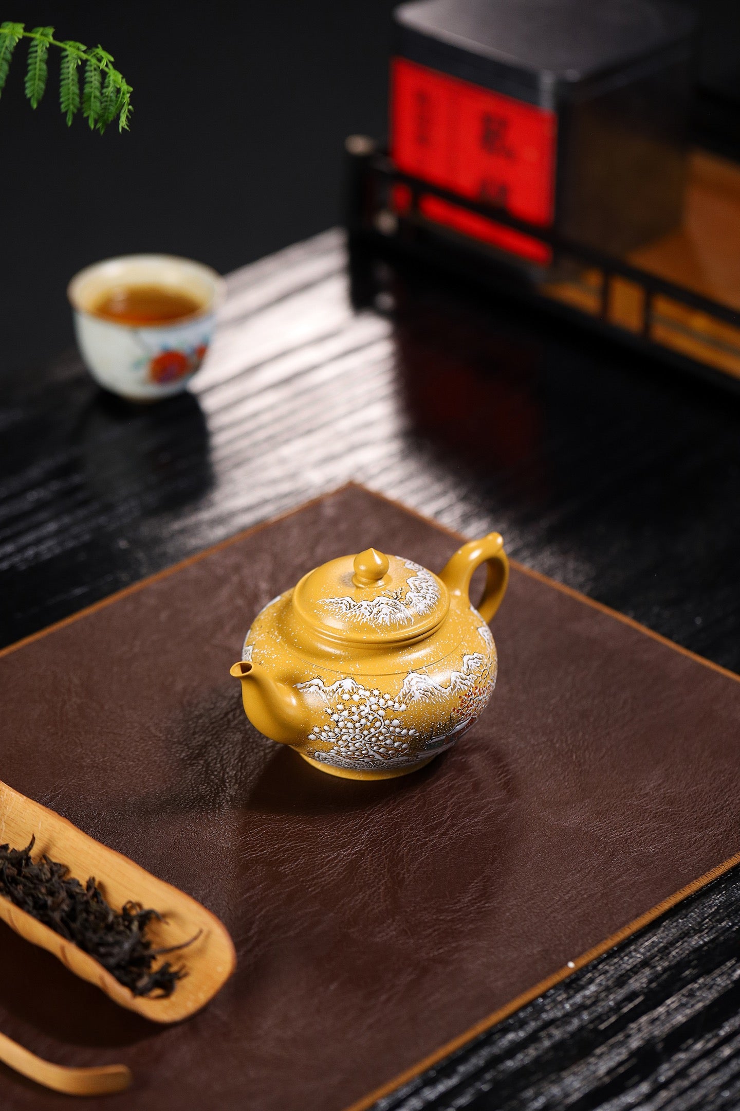Handmade Yixing purple sand teapot with intricate design, showcasing craftsmanship and elegance.