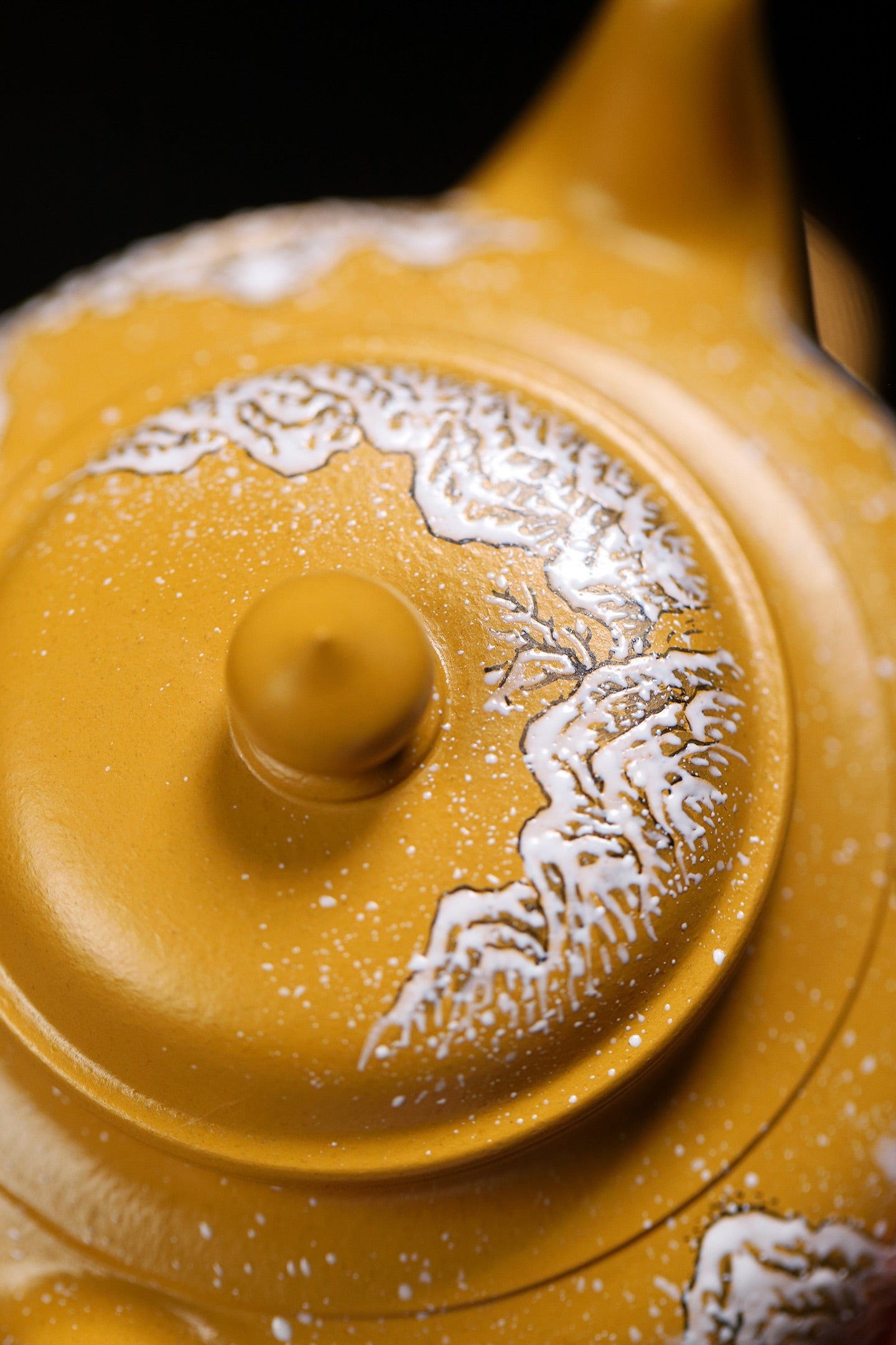 Handmade Yixing purple sand teapot featuring intricate snow scene designs, showcasing traditional craftsmanship.