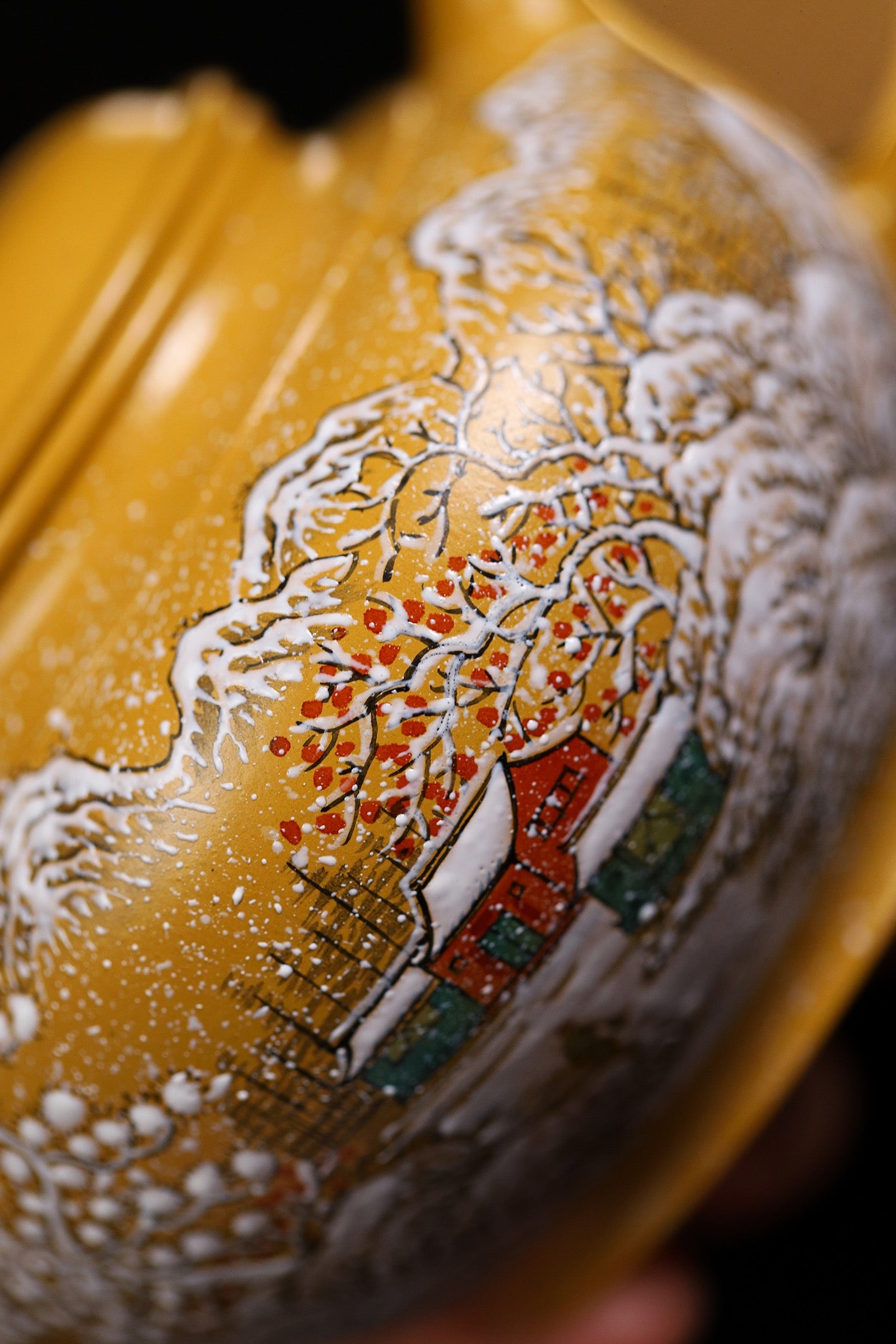 Handmade Yixing purple sand teapot featuring a snow scene design, showcasing intricate craftsmanship and traditional artistry.