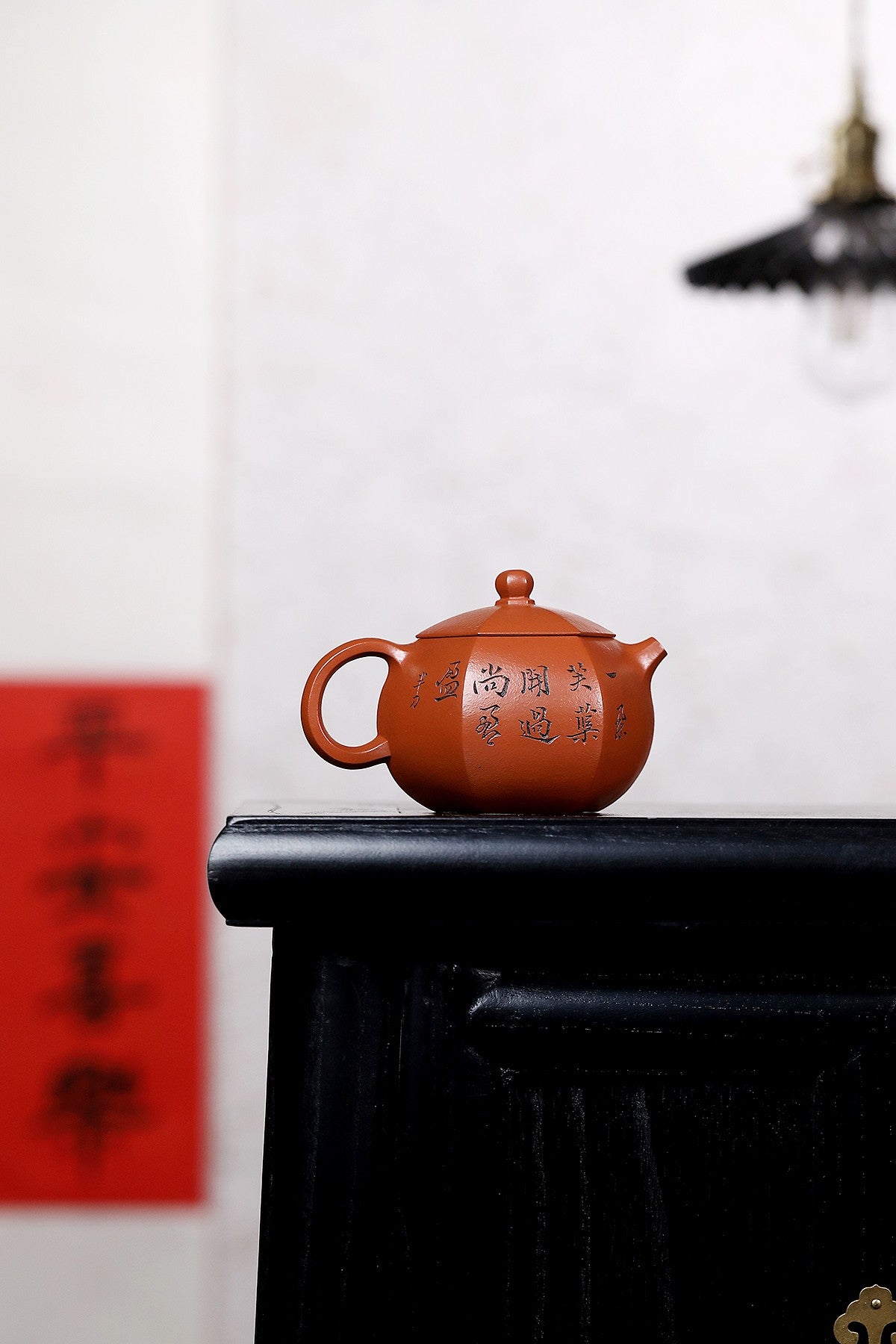 Handmade Yixing purple sand teapot with elegant calligraphy, showcasing fine craftsmanship and artistic design.