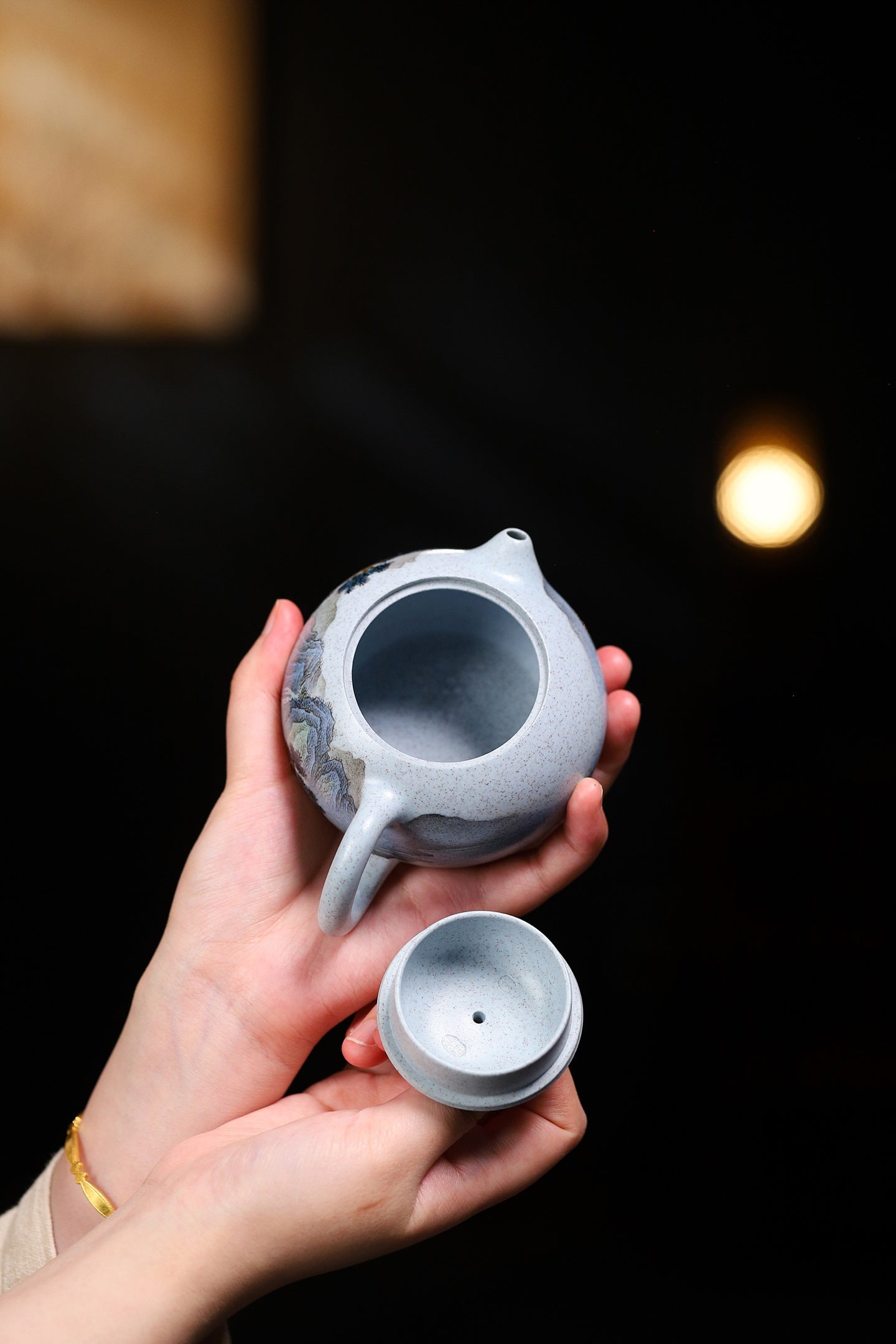Handmade Yixing purple sand teapot with lid, showcasing the unique design and craftsmanship.